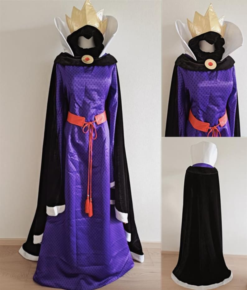 May include: A purple costume with a gold crown, black cape, and orange belt. The long dress has a high collar and a red jewel. The black cape has white trim. The costume is displayed on a mannequin.