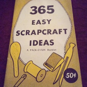 May include: A vintage booklet titled "365 Easy Scrapcraft Ideas" with a yellow cover and illustrations of crafting tools. The cover features a white oval with the title and the text "A PACK-O-FUN Booklet". A price of 50¢ is in the lower right corner.