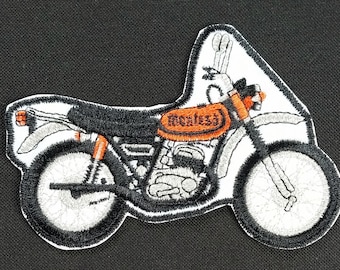 Vintage geborduurde Montesa-motorfiets uit de jaren 60 of 70