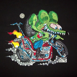 May include: A green monster with large eyes and sharp teeth riding a motorcycle with flames coming out of the back. The motorcycle is red and black with a silver frame. The monster is wearing blue jeans and black boots. The text "Roth TM" is visible in the bottom right corner.