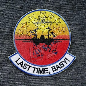 May include: Embroidered patch featuring a tiger design, encircled by yellow stars and a yellow and red backdrop. The patch includes the text "LAST TIME, BABY!" in white lettering on a blue-edged banner.