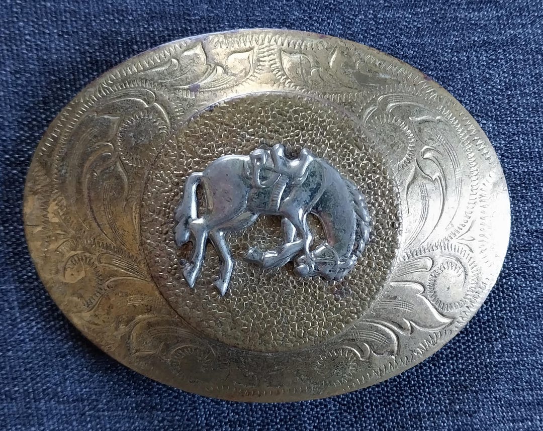 Montana Silversmiths western belt buckle (cowboy riding a bucking
