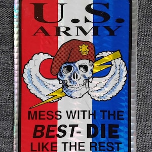 May include: A sticker with a red, white, and blue background. It features a skull with a beret and wings, a lightning bolt, and the text "U.S. ARMY" and "MESS WITH THE BEST - DIE LIKE THE REST".