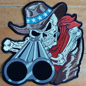 May include: A skeleton wearing a cowboy hat with stars and a red bandana is holding a double-barreled shotgun. The skeleton is aiming the shotgun at the viewer.