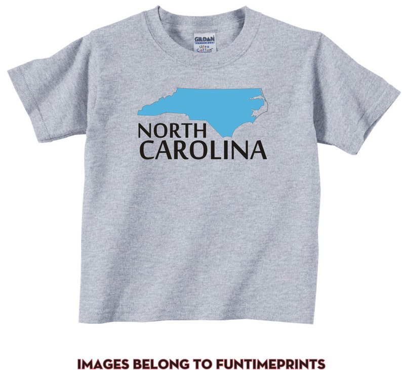 May include: A gray t-shirt with a blue outline of the state of North Carolina and the text "NORTH CAROLINA" in black.