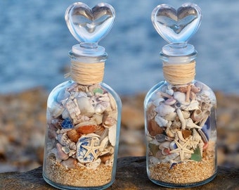 Glazen fles strandschat: nautisch decor schelp en zeester