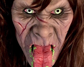 Máscara de goma de látex Chica demonio desliza la lengua
