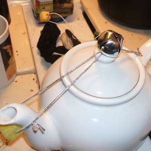 Silver Jingle Bells teapot dripcatcher