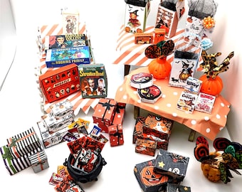 May include: A collection of miniature Halloween-themed items including small gift boxes, candy packages, cereal boxes, and decorative pumpkins. The set features various spooky graphics, black and orange color schemes, and small black cauldrons.