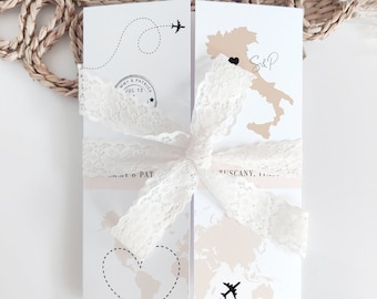 May include: A wedding invitation with a travel theme. The invitation features a map of Italy with a heart over Tuscany, a plane flying over a world map, and the text "S&P" and "Tuscany, Italy".
