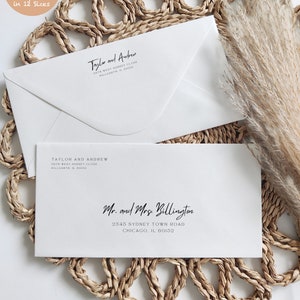 May include: Two white envelopes with black calligraphy for wedding addresses. The top envelope reads "Tayler and Andrew" with an address in Hillgarth, IL 60152. The bottom envelope reads "Mr. and Mrs. Billington" with an address in Chicago, IL 60152.