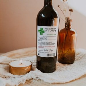 May include: A prescription bottle label for white wine with a green cross and the words "Prescription White Wine" and "Solly" on it.
