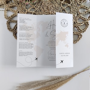 May include: A wedding invitation with a world map background and a plane illustration. The invitation reads "H & S are excited to invite you to celebrate their wedding" and "July 13th, 2025, Cancun, Mexico".