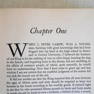 May include: Open book page with the title "Chapter One" in a serif font. The text begins with a large, ornate "W" and continues with paragraphs of printed text. The paper is aged, with a slightly yellowed tone.