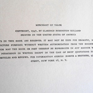 May include: A close-up of a printed page from the book "Merchant of Valor." The text includes copyright information from 1947 by Clarence Budington Kelland, printed in the United States of America. The text also includes a statement of reserved rights.