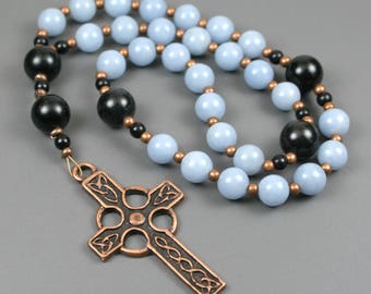 Anglican rosary in blue angelite and obsidian with an antiqued copper Celtic cross