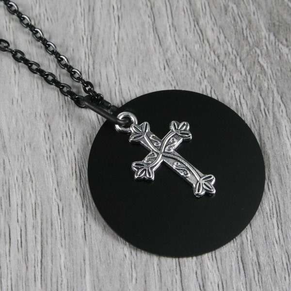 Silver plated cross with vines pendant with a black anodized aluminum background on a black cable chain necklace