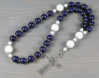 Anglican rosary in navy blue wood and matte snow white jade with a Celtic cross