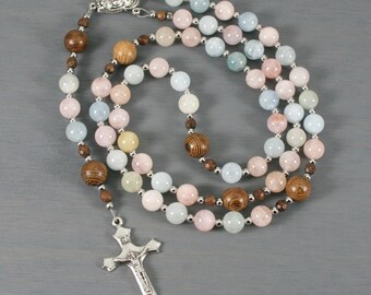 Beryl, morganite, aquamarine, wood, and silver rosary in the Roman Catholic style