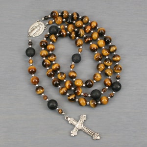 Catholic rosary in tiger eye with a Miraculous medal centerpiece