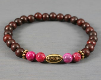 CLEARANCE - Pink crazy lace agate and red ebonywood stretch bracelet with an antiqued gold plated LOVE bead