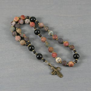 Anglican rosary in matte red creek jasper and ebony blackwood with a small bronze colored cross
