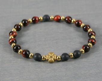 Anglican rosary stretch bracelet in red tiger eye, matte black onyx, & gold-plated floral cross