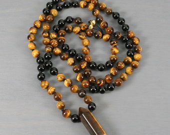Tiger eye and black onyx hand knotted mala with a hexagonal tiger eye crystal point