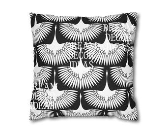 May include: A square throw pillow featuring a repeating pattern of white stylized birds with spread wings against a solid black background. The text DREAM DECOR IDEAS is printed in white in multiple locations across the surface of the pillow.