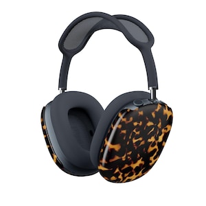 May include: Over-ear headphones with a dark gray headband and earcups. The earcups have a tortoiseshell pattern on the outside. The headphones are designed for comfort and style, perfect for listening to music or podcasts.