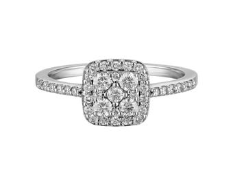 May include: A silver ring with a square-shaped center stone surrounded by smaller diamonds. The band is also set with small diamonds.