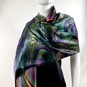 May include: A black satin scarf with a colourful abstract swirl pattern in shades of green, purple, yellow, and orange.