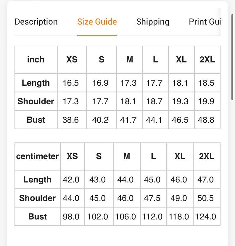 May include: A size guide chart for apparel featuring columns for sizes XS through 2XL. The table displays measurements in inches and centimeters for length, shoulder, and bust. The top navigation includes tabs for Description, Size Guide, Shipping, and Print Guide.