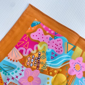 ambien doodles scarf; cute abstract print headscarf with 90s inspired colorful doodles; neon; 80s; brown square kerchief