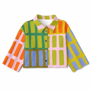 May include: A button-down shirt featuring a vibrant, multi-colored geometric pattern of rectangular blocks in shades of green, pink, orange, yellow, and blue. The shirt has a pointed collar, long sleeves, and a single chest pocket on the right side.