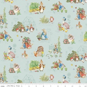 May include: A blue and white fabric featuring a repeating pattern of Peter Rabbit characters. The characters include Peter Rabbit, Benjamin Bunny, and Mrs. Tiggy-Winkle. The fabric is ideal for quilting, sewing, and crafting.