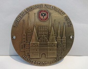 Plaque car vintage "1st International Destination 1982 Hanseatic City of Lübeck".