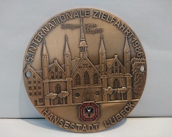 Plaque car vintage "5th International Destination 1986 Hanseatic City of Lübeck".