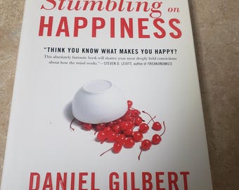 Stumbling on Happiness by Daniel Gilbert. UNREAD 2006 Hardcover/DJ. Free Media Mail shipping in the USA. ChuckBooks