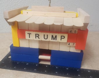 Trump Bird House. Handmade from "Jenga" Style pieces. Orange, Yellow, Blue, Red and Wood. Free Ground Advantage shipping in the USA. ChuckBo