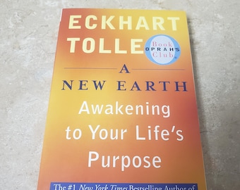 A New Earth by Eckhart Tolle. 2006 Unread Paperback. FREE Media Mail shipping in the USA. ChuckBooks