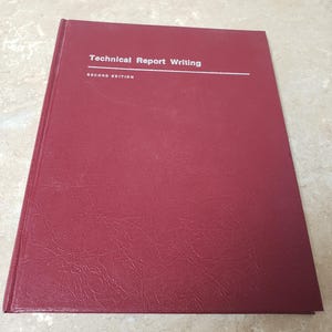 May include: A burgundy hardcover book with the title "Technical Report Writing" and the words "Second Edition" printed in white.