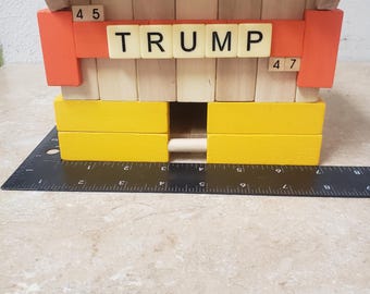 Trump Bird House. Handmade from "Jenga" Style pieces. Orange, Yellow, and Wood. Free Ground Advantage shipping in the USA. ChuckBooks