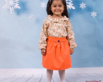 Girls skirt in orange cotton with blue heart button