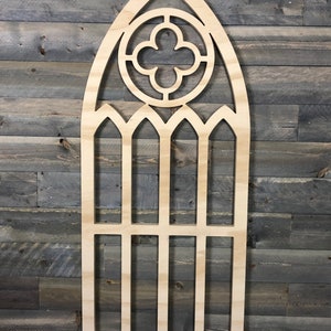 Arched window frame with quatrefoil