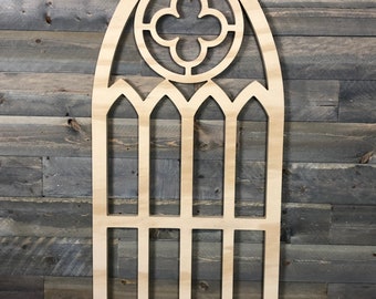 Arched window frame with quatrefoil