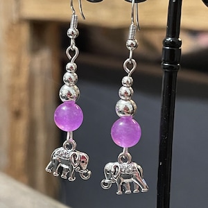 Elephant earrings dangling in silver metal elephant and purple glass pearl