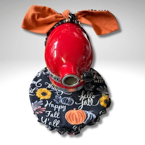 May include: A red stand mixer with an orange bow and a black and white patterned band. The mixer is adorned with a black cover featuring sunflowers, pumpkins, and the text "Happy Fall Y'all" and "Hello Fall".
