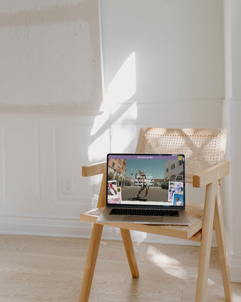 May include: A laptop computer on a wooden chair with a website open on the screen. The website has a light purple background with the text "Your life, your style, your story" in white. The website also features images of people skateboarding and other activities.