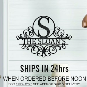 May include: Matte black metal monogram sign with the letter "S" in a circle and the text "THE SLOAN'S" below. The sign has decorative scrollwork and is mounted on a white wall.  SHIPS IN 24hrs WHEN ORDERED BEFORE NOON FOR 11/27-12/25 SEE APPROX SHIP & DELIVERY DATE FOR YOUR ZIP CODE BELOW BEFORE ORDERING